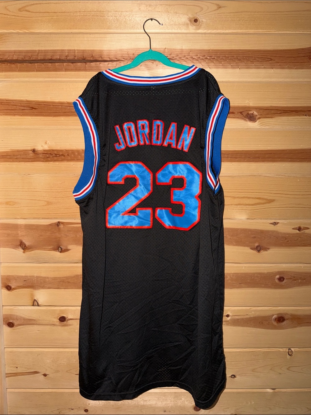 Black Basketball Jersey with 'Jordan' 23 – Blue & Red Accents- Space Jam